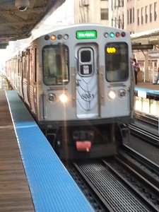 The Green line train rolls into the station.